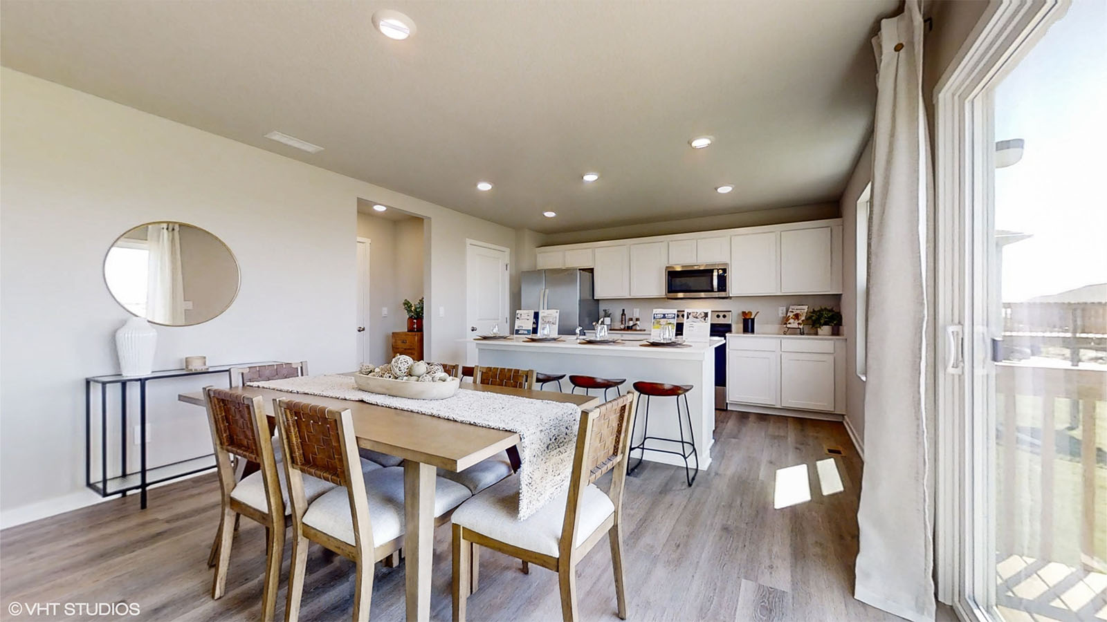 Dining room area with kitchen in back