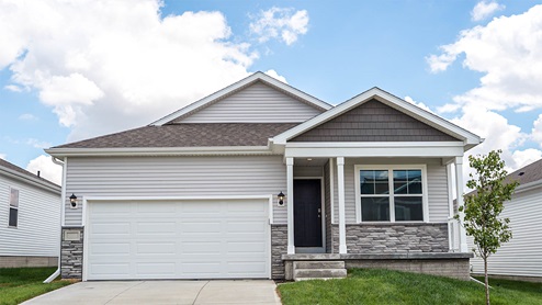 Exterior of the Rolland with grey siding, stone and 2 car garage