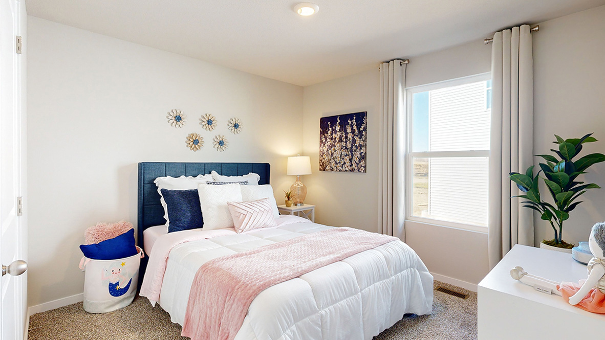 Third bedroom in the Hamilton with a full bed and white dresser