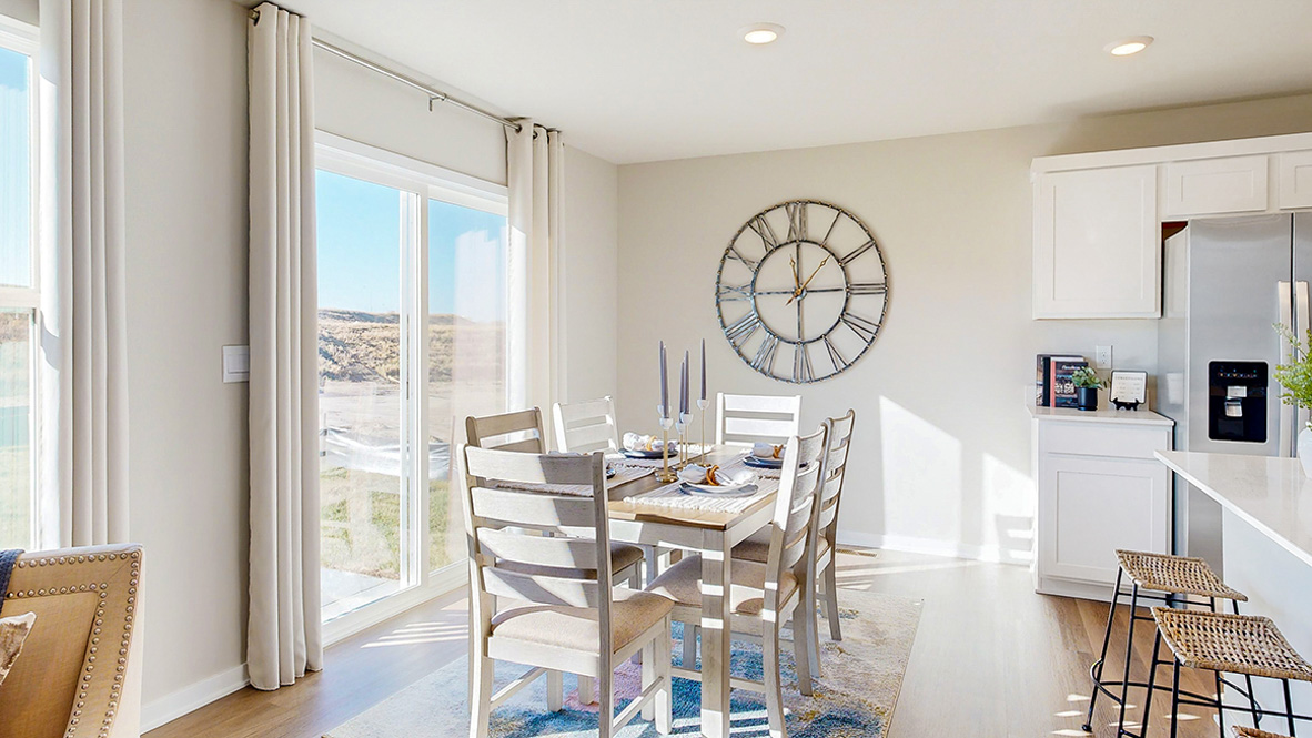 Dining area of the Hamilton with sliding glass doors