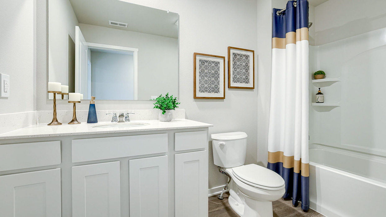 Second bathroom with a sink toilet and tub in the Bellhaven