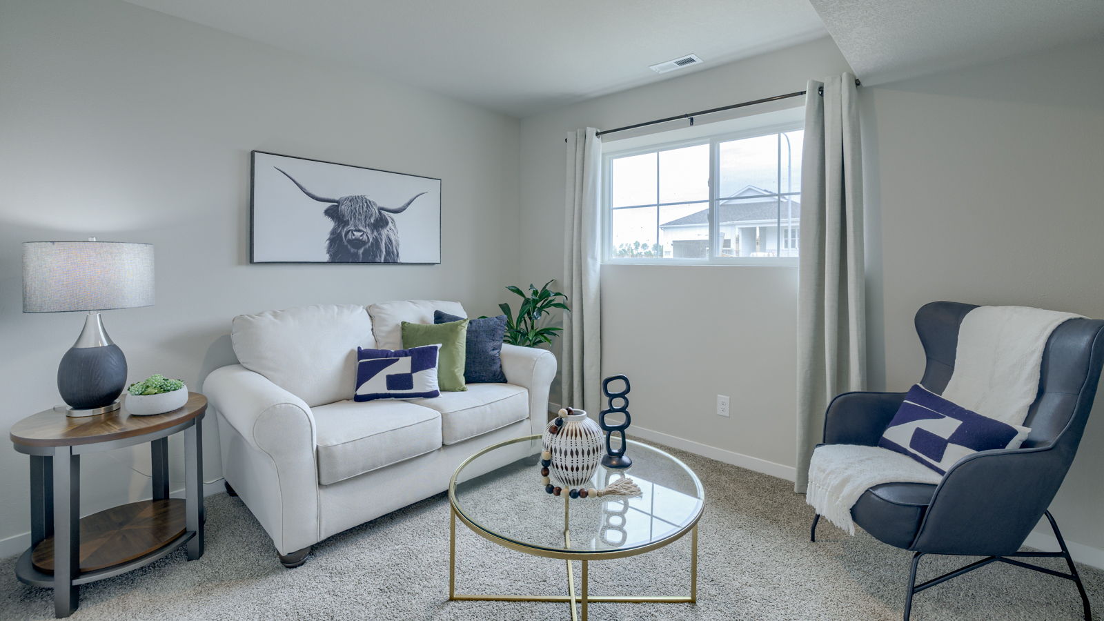 Basement rec area of Fremont floorplan staged as a living space