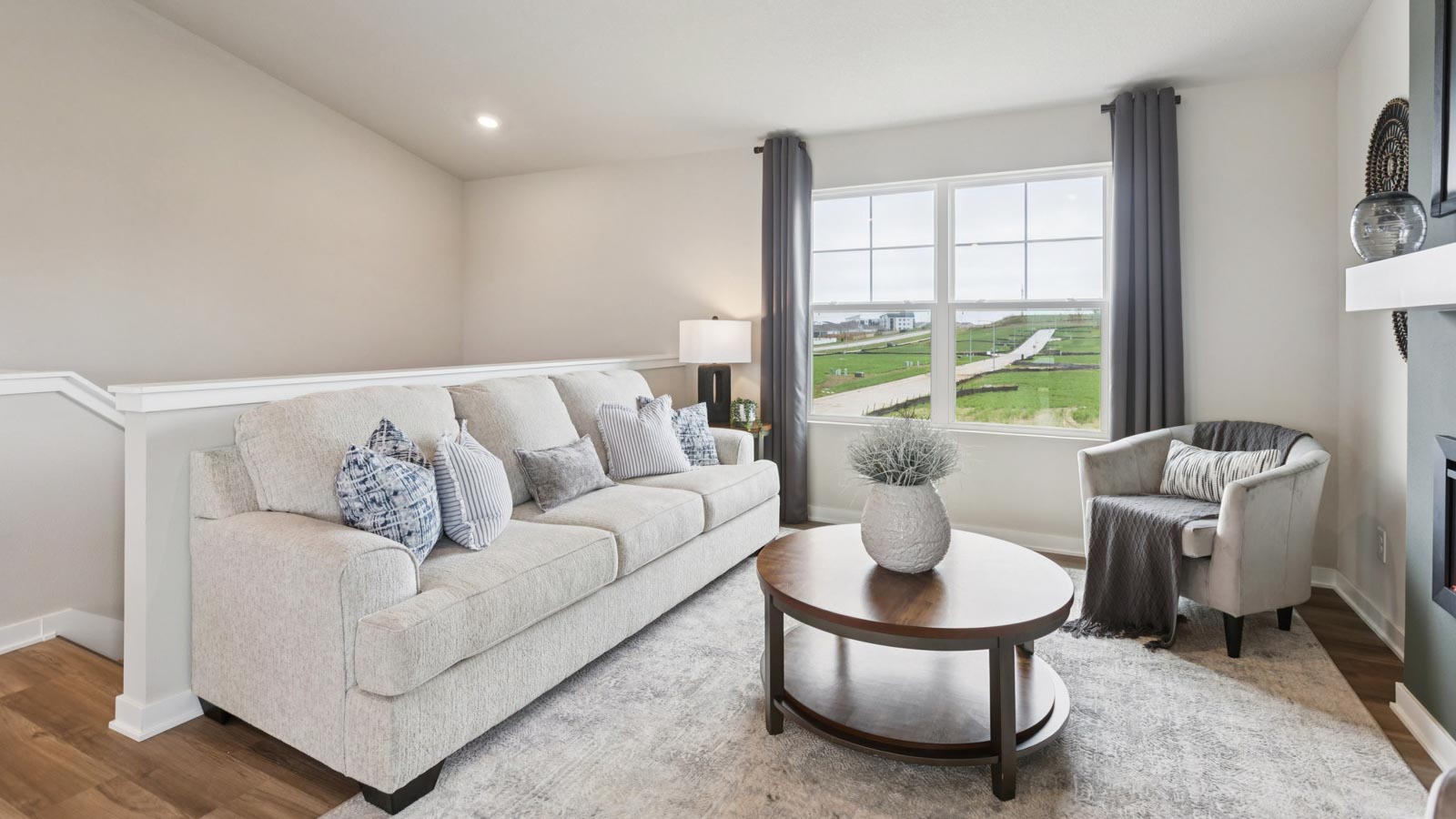 Fremont living room with large window and stairway down to front door