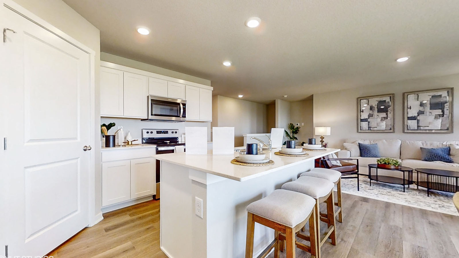 Kitchen of the Hamilton with the view of the living room