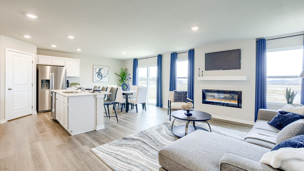 Overview of the dining area and kitchen from the living room in the Hamilton