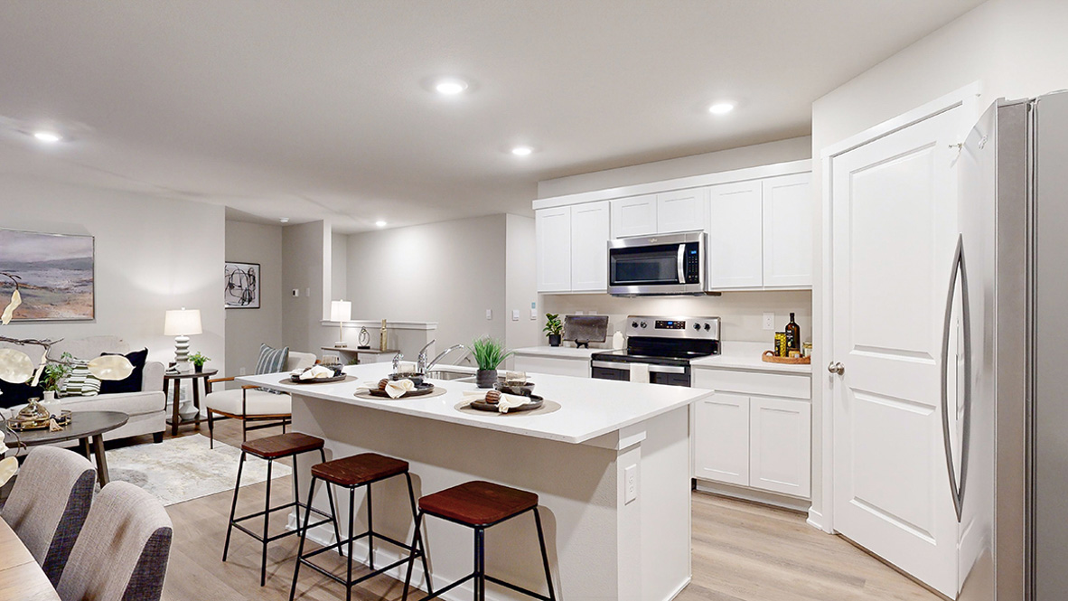 Hamilton kitchen with white cabinets overlooking the living room