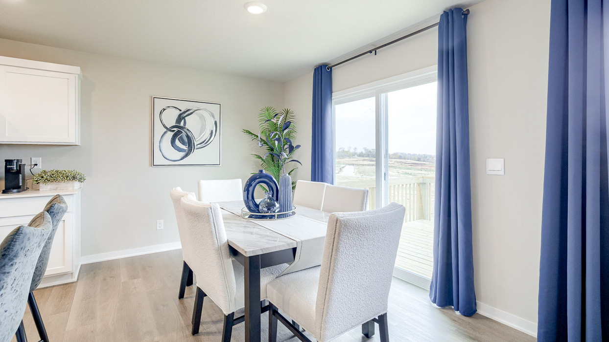 Hamilton dining room with table that seats six and sliding glass doors