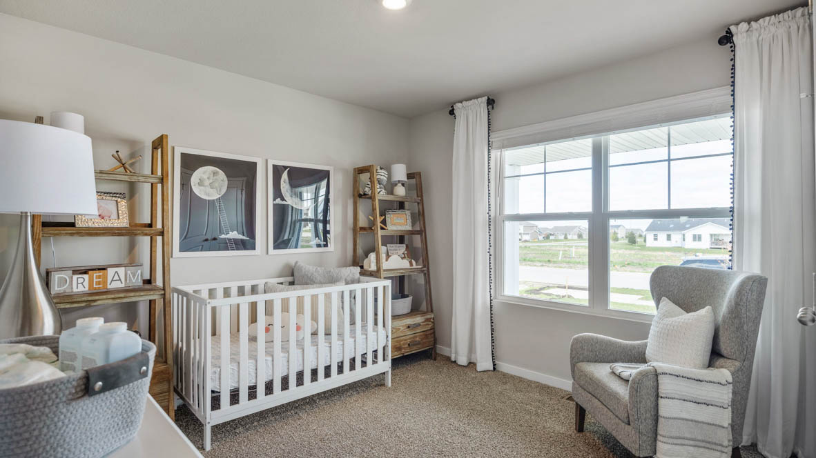 Third bedroom staged as a nursery