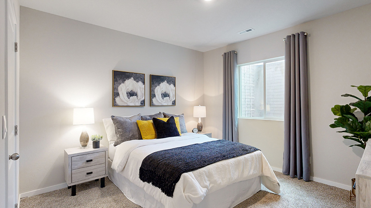 Fifth bedroom in the finished basement of the Roland with a queen bed