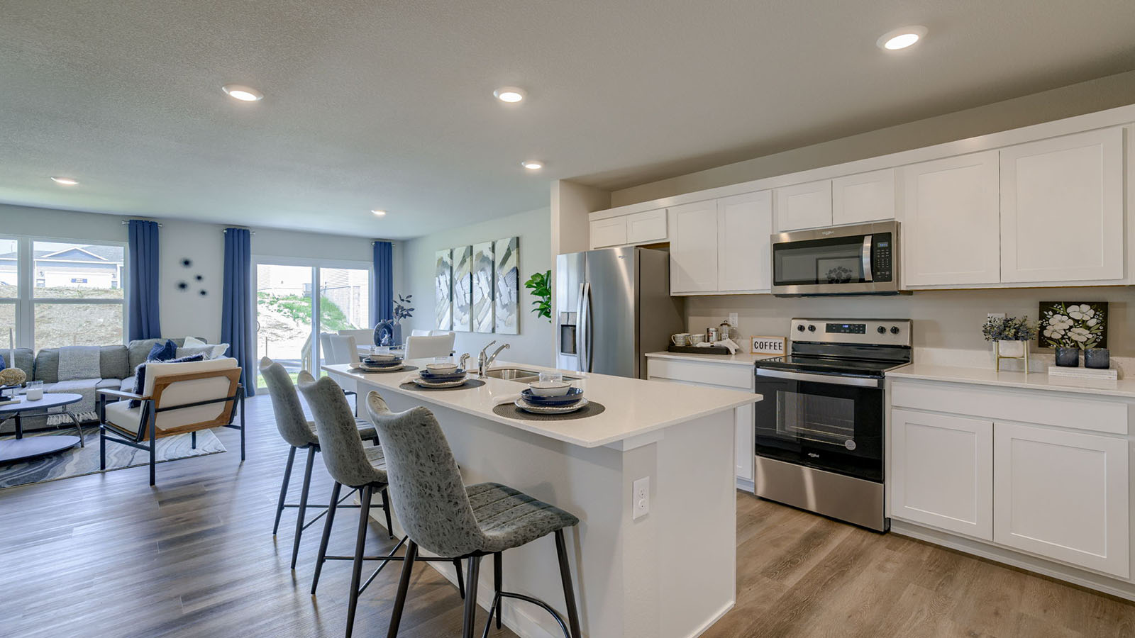 Roland kitchen looking to the living room and dining room