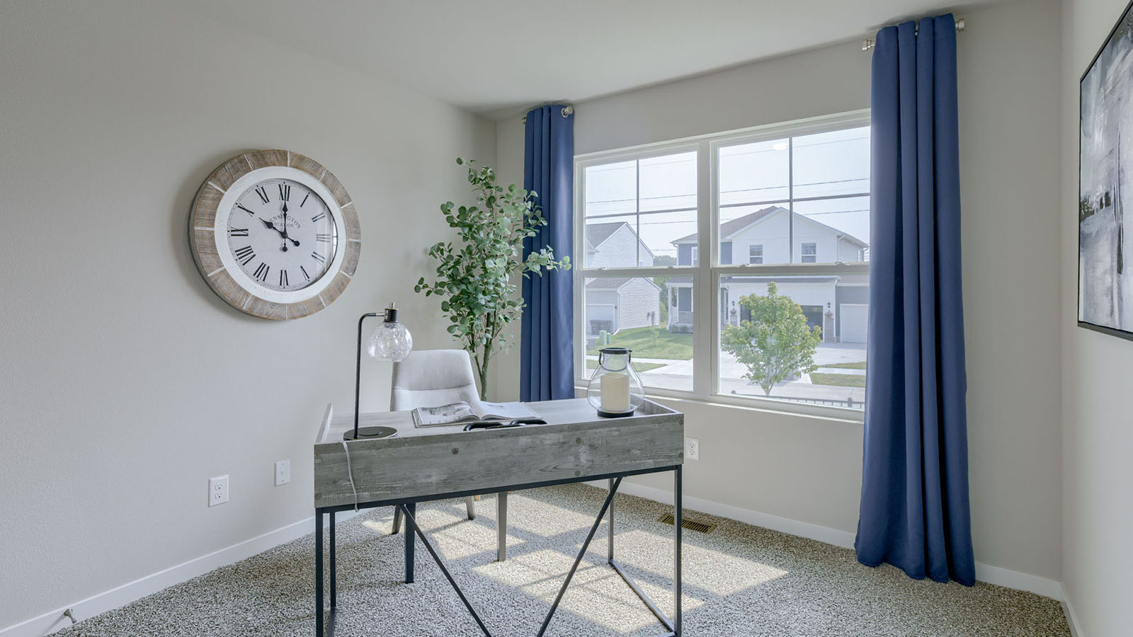 Second bedroom in the Roland staged as an office