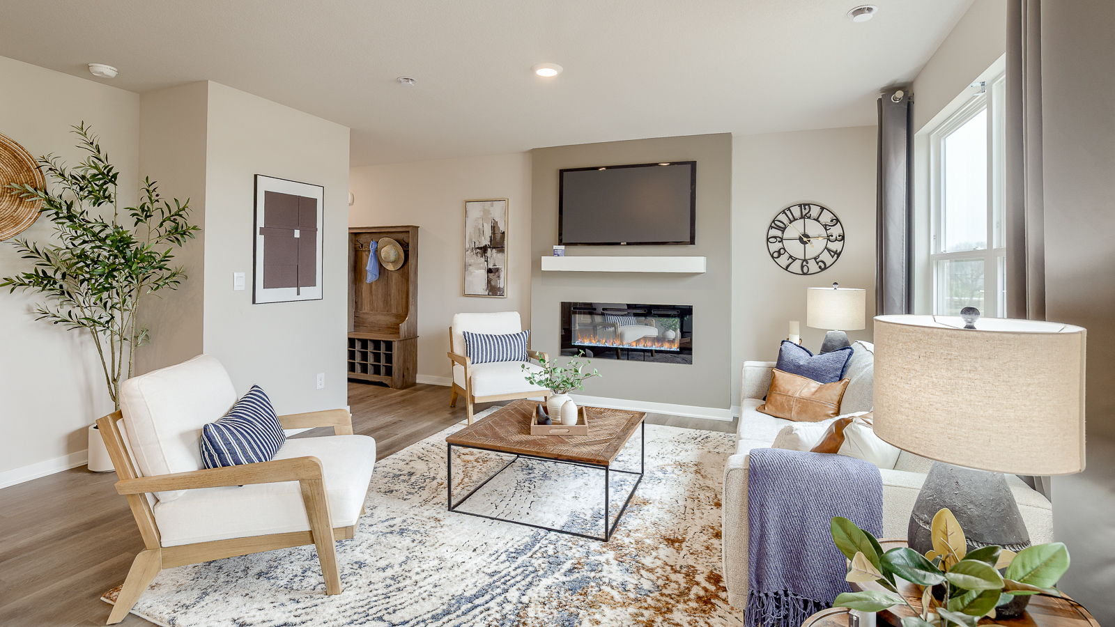 living room of sydney with electirc fireplace and large windows