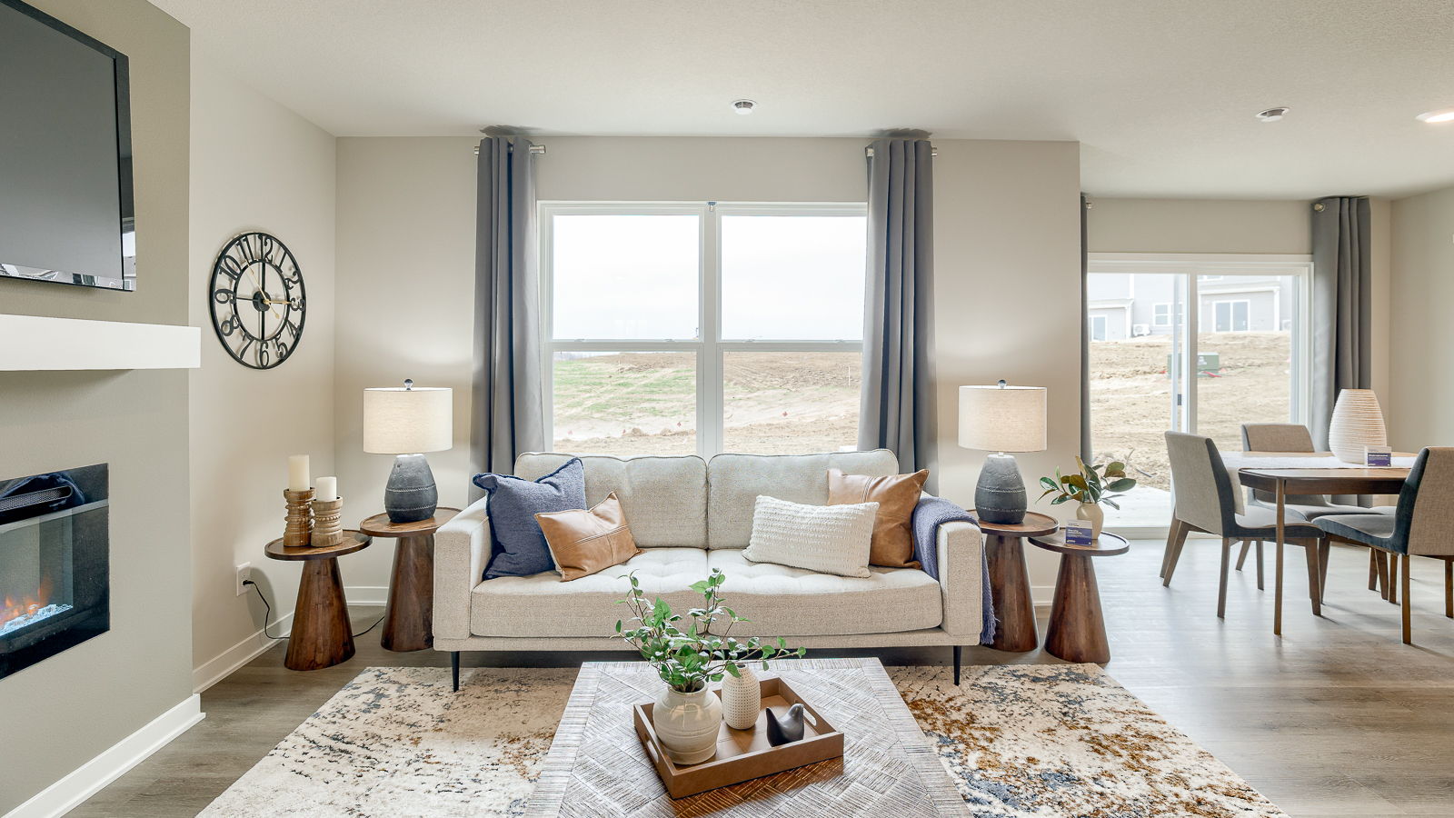 Large window in the living room behind the couch