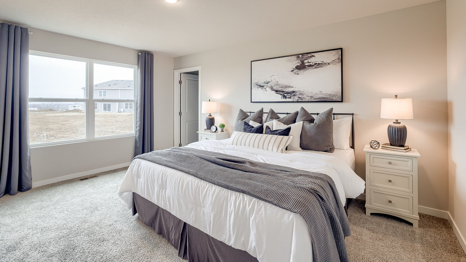 Spacious primary bedroom in the Sydney with large window providing natural light