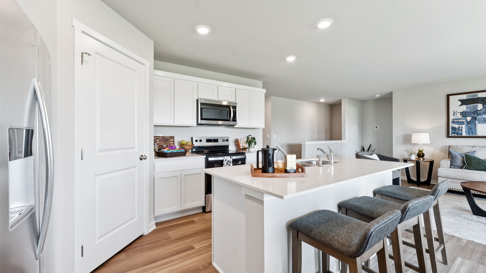 Overview of open concept kitchen in the hamilton with a large island