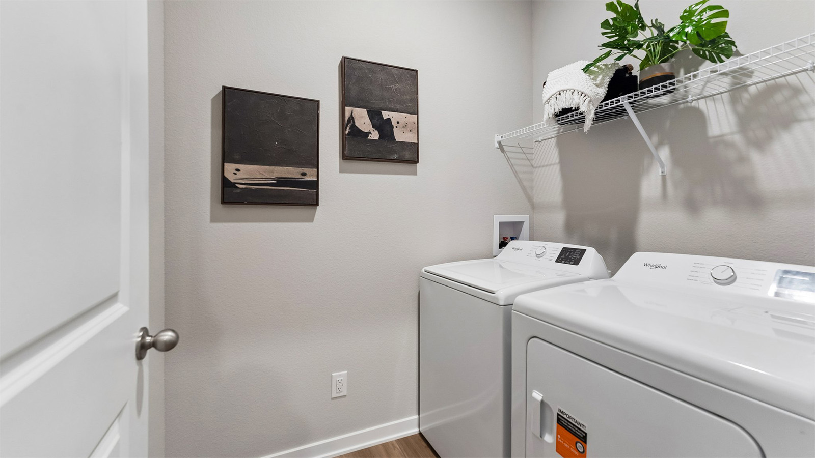 Laundry room in the Hamilton with shelf