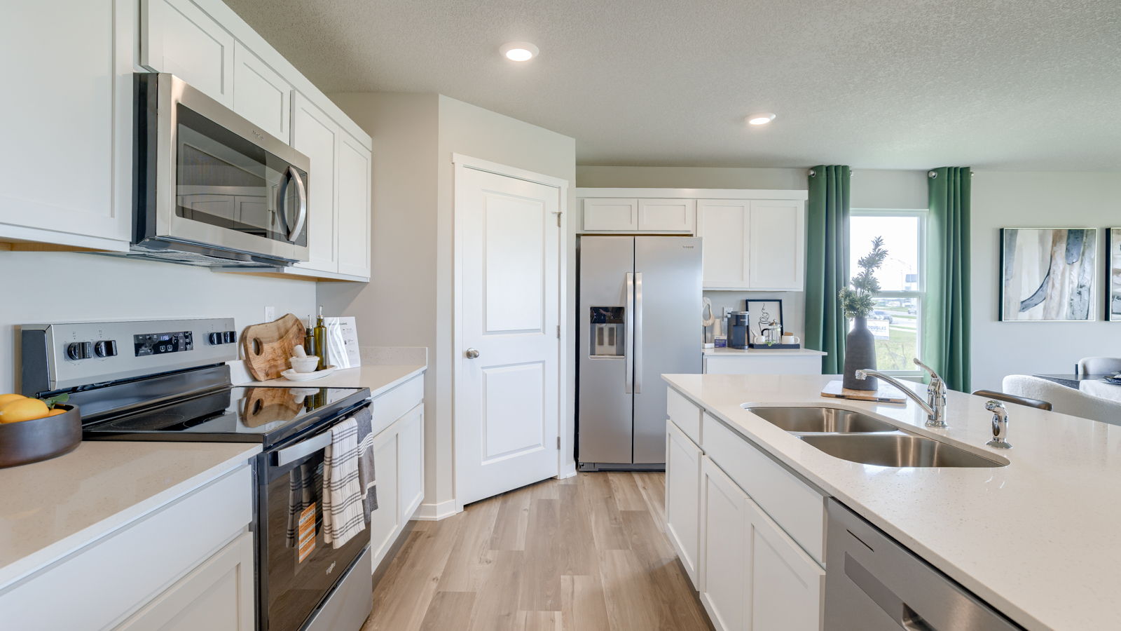 Kitchen in the Neuville with stainless steel appliances and