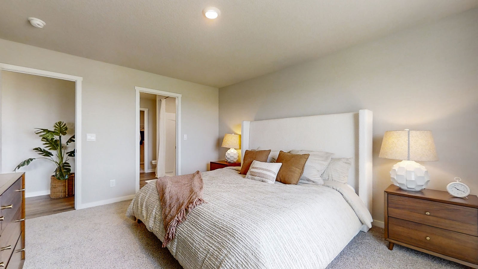 Primary bedroom of the Hamilton showing the ensuite bathroom