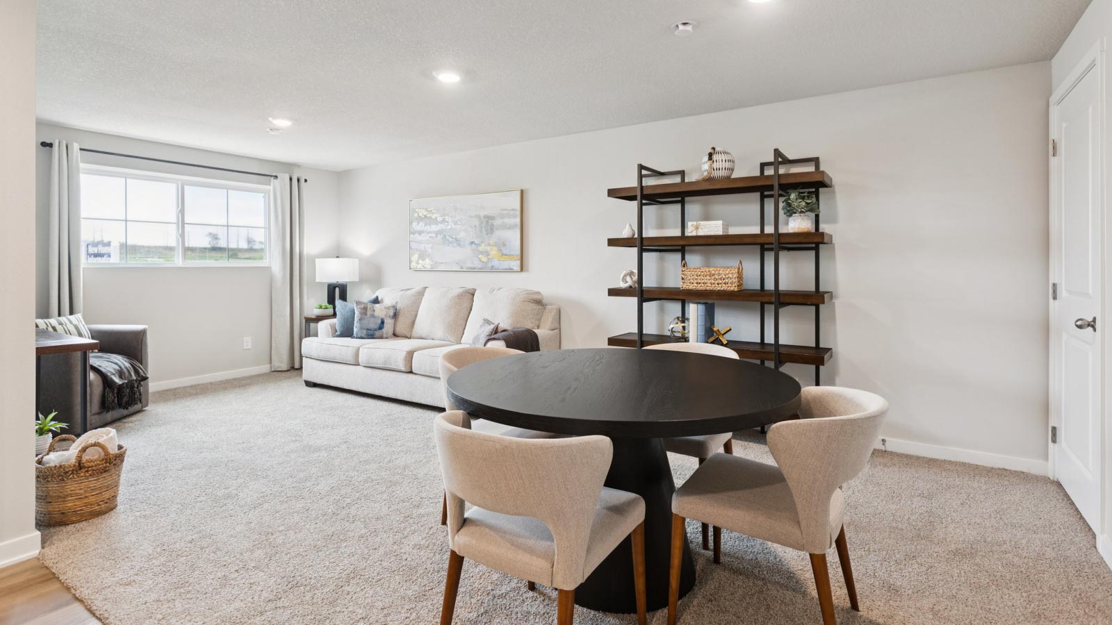 Upstairs loft with multi-use design, windows, wide landing, and access to bedrooms and family bathroom