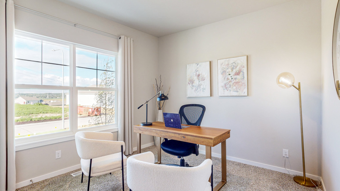 Second bedroom staged as an office