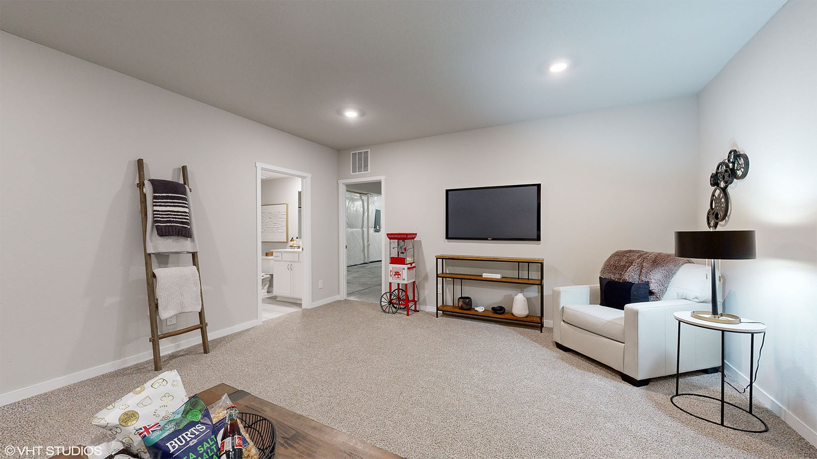 finished basement with entertainment area and popcorn machine