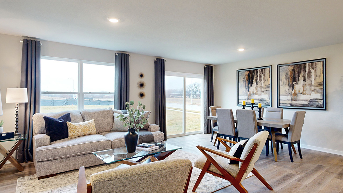 Living room and dining room in the Roland with sliding glass door