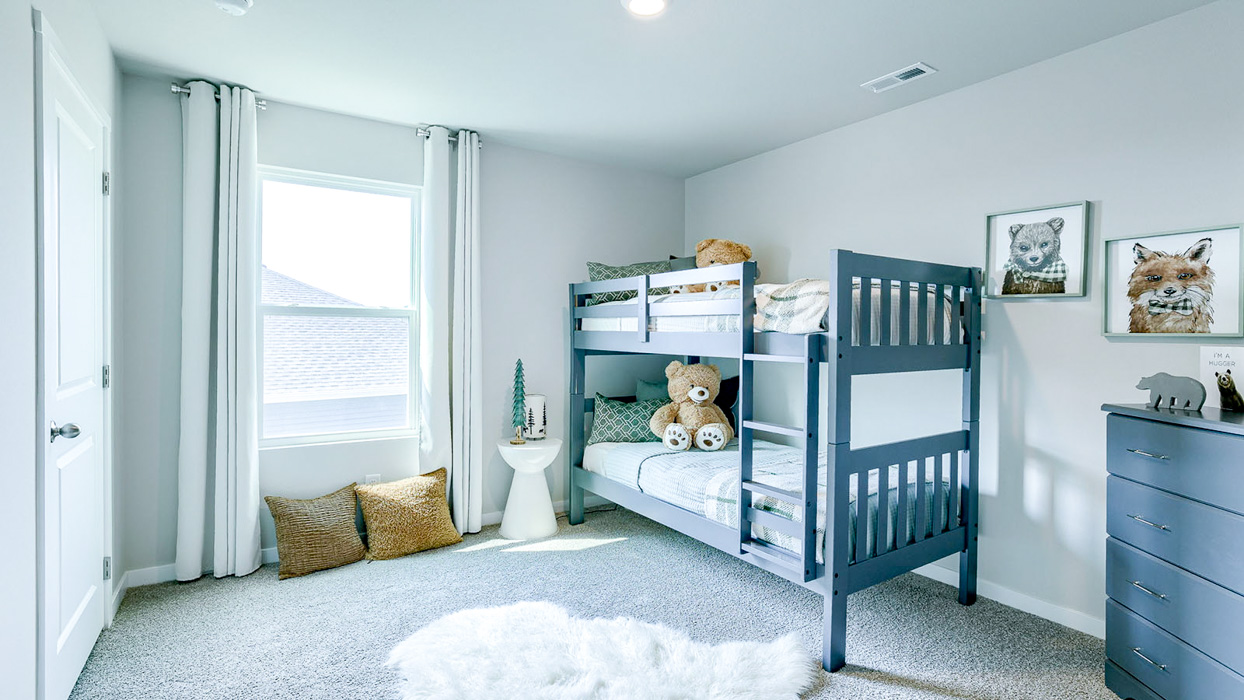 Third bedroom in the Bellhaven with bunk beds and bright windows