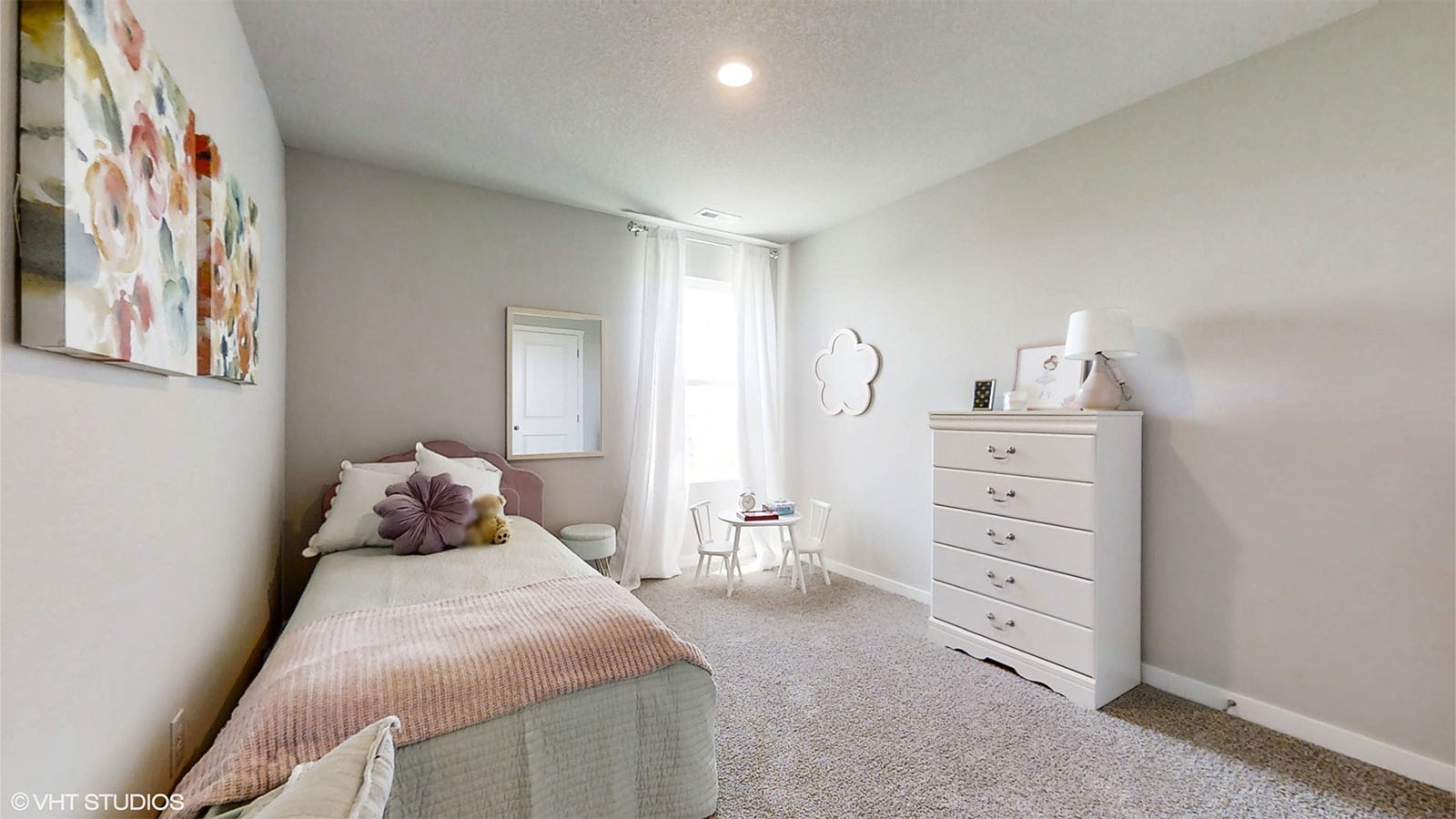 Third bedroom in the Bellhaven with twin bed dresser and window for natural light