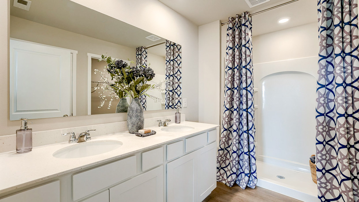 Bellhaven primary bathroom with dual sinks and walk-in shower
