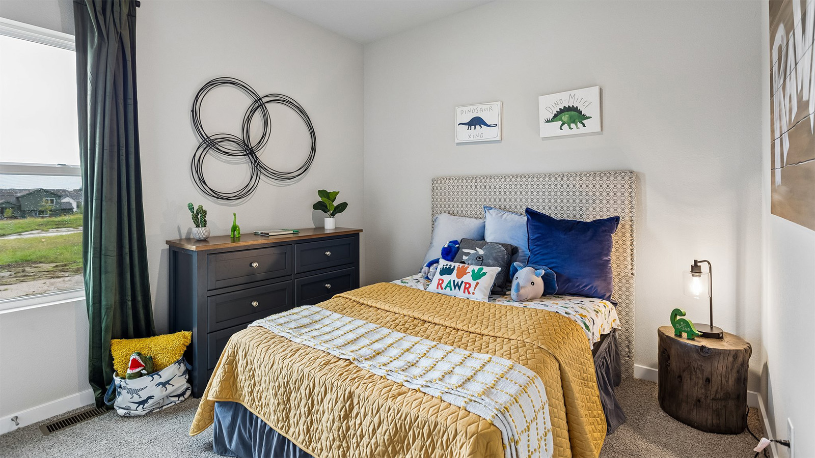 Third bedroom in the Abbott staged in a dinosaur theme