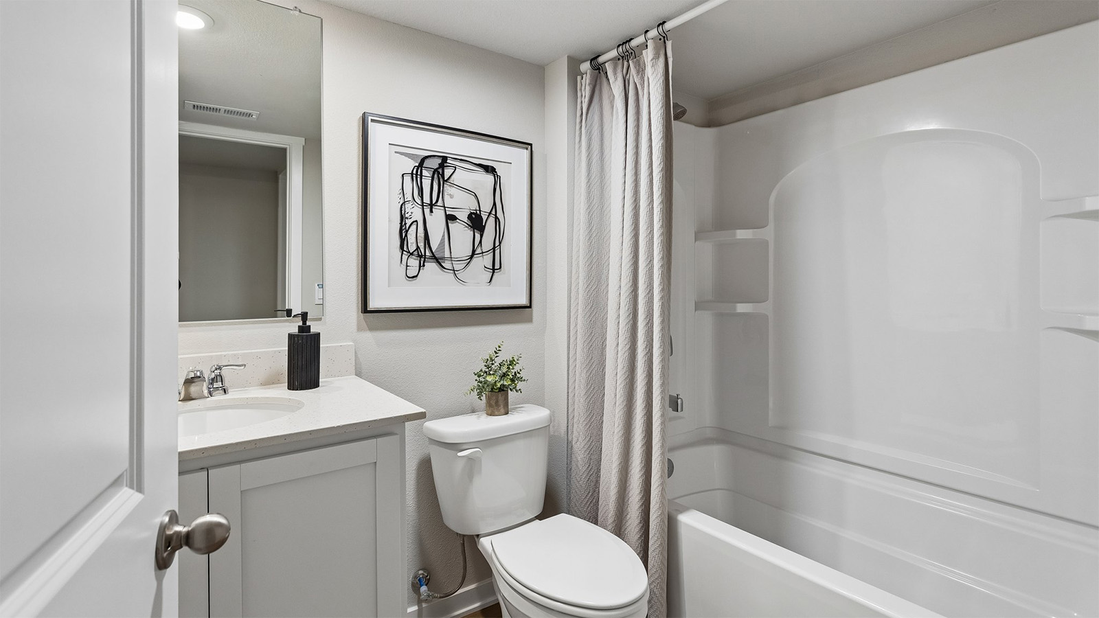 Third bathroom in the Abbott finished basement with a bathtub