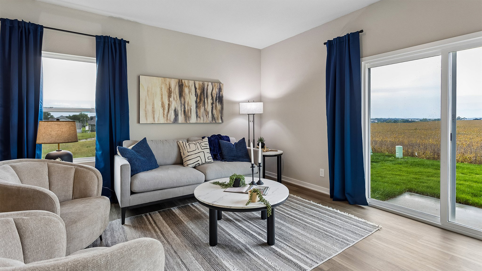 Abbott living room with sliding glass door and large window
