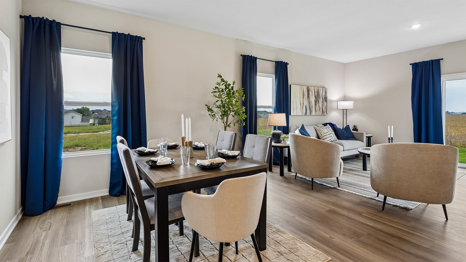 Open-concept dining area and living room in the Abbott