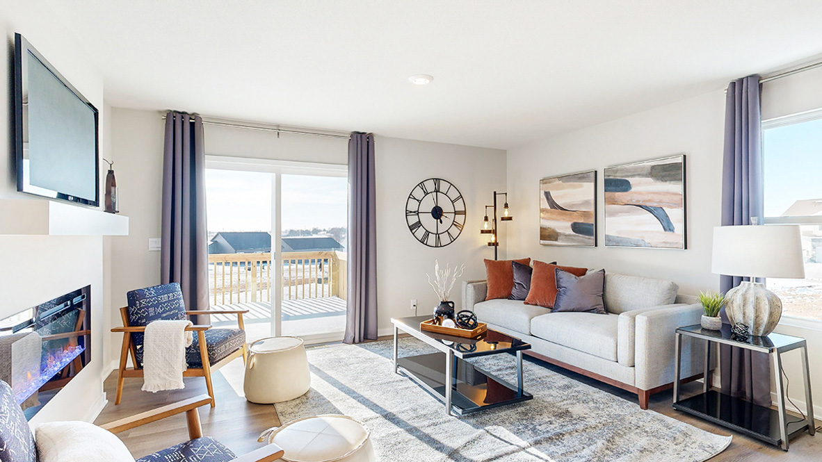 Bright living room with fireplace in Abbott