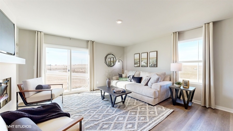 Abbott living room showcasing bright windows and white couch