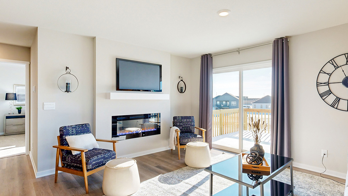 The Abbott open living room with sliding glass doors to deck