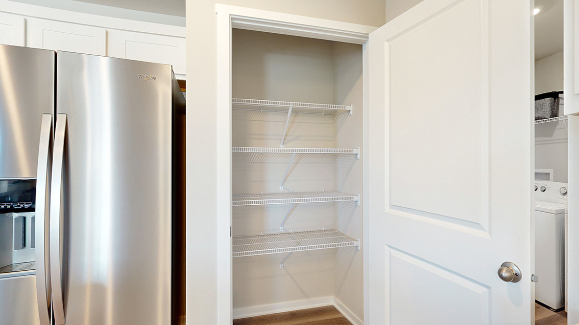 Stainless steel fridge and pantry in the Abbott kitchen