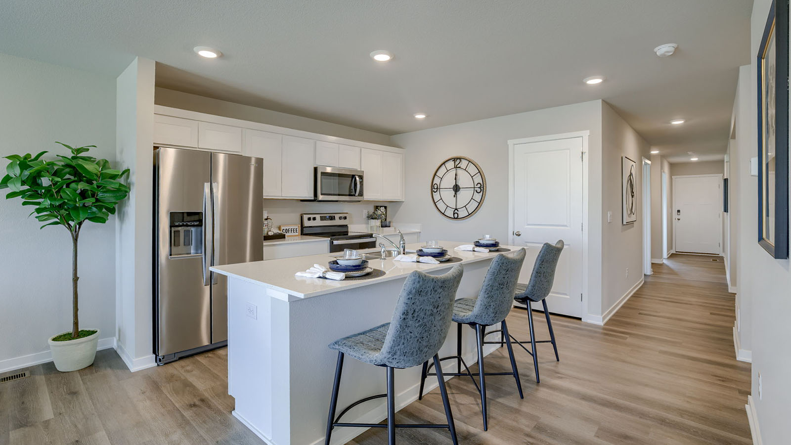 Roland kitchen with island and 3 chairs