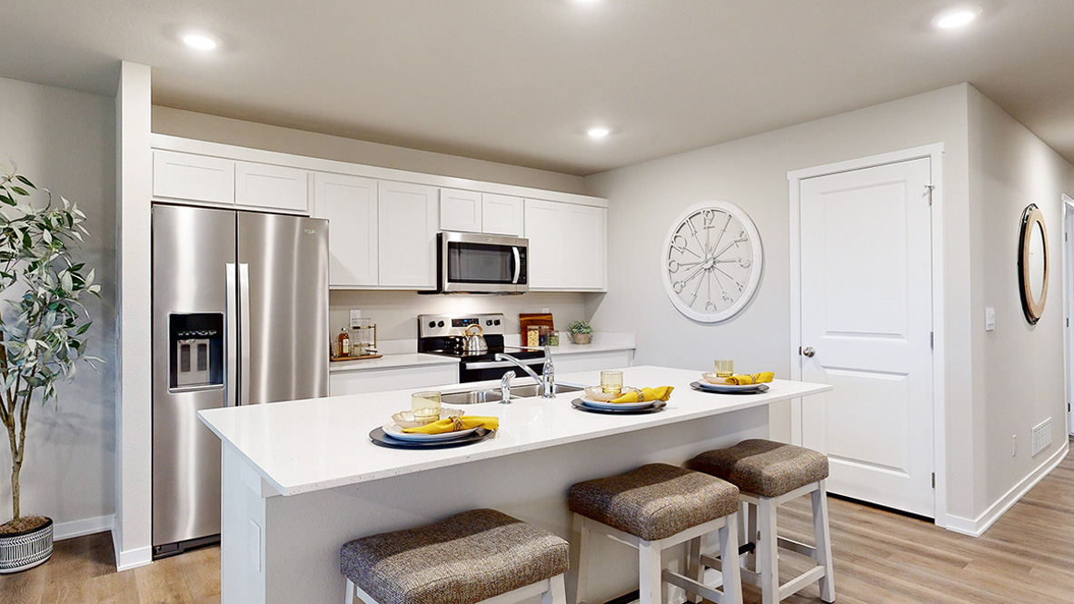 Bright kitchen of the Roland with white cabinets