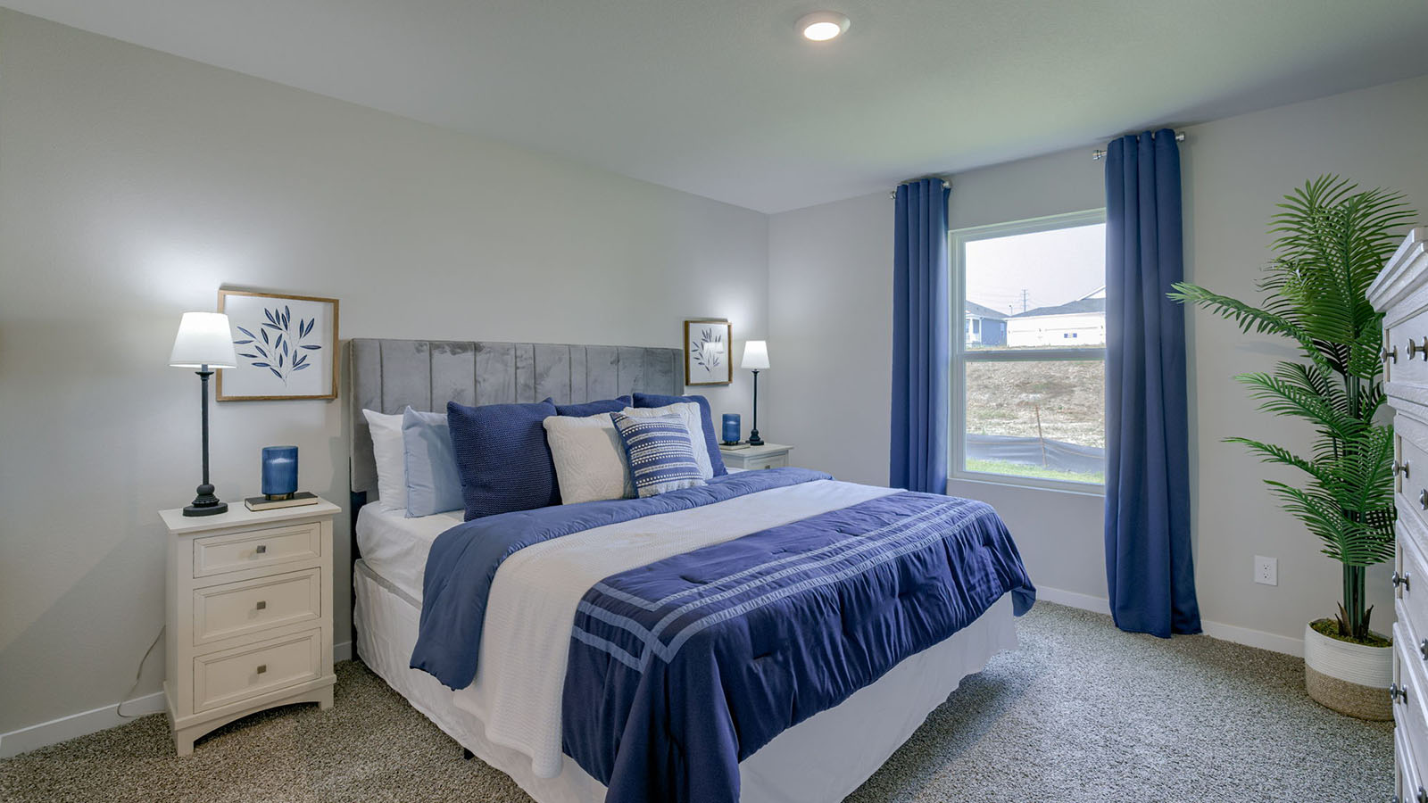 Primary bedroom in the Roland with a king bed and two night stands