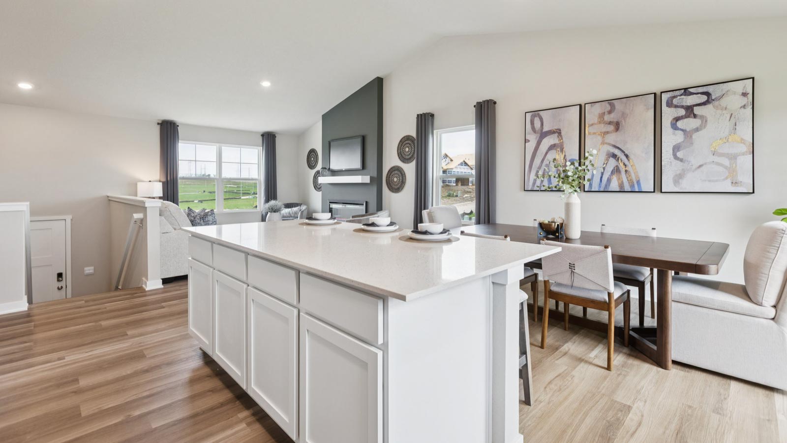 Kitchen showcasing new stainless steel appliances, cabinets, and countertops.