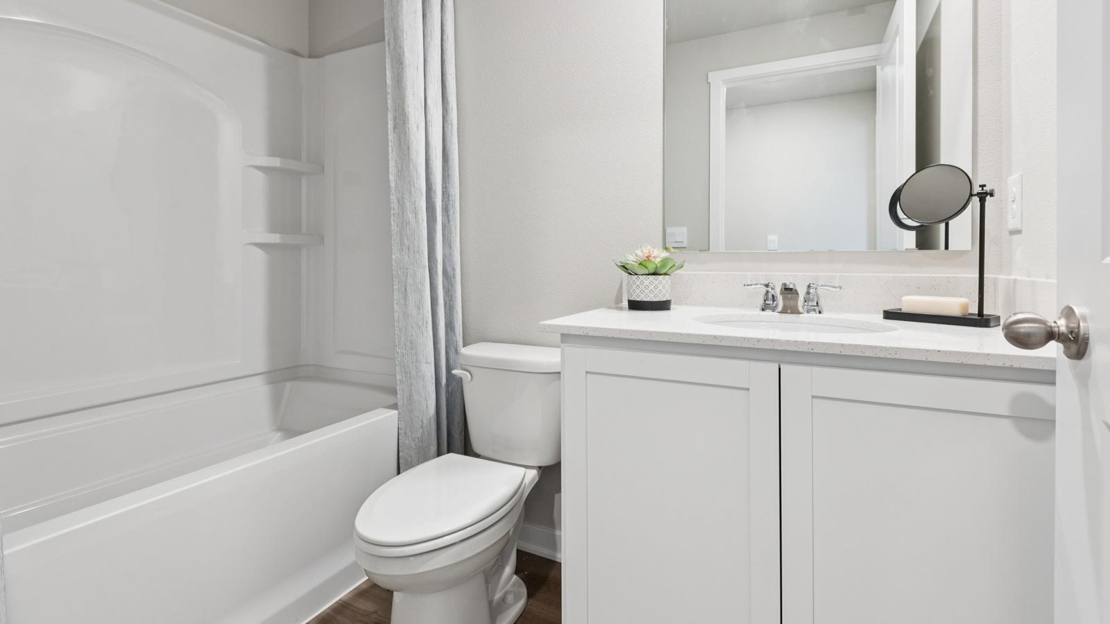 Bathroom featuring a sink, toilet, and shower tub.