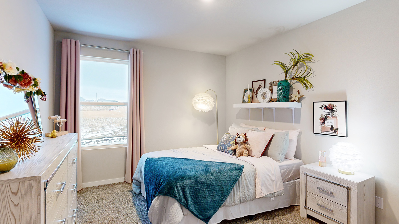 Second bedroom in the Reagan with a queen bed and white dresser