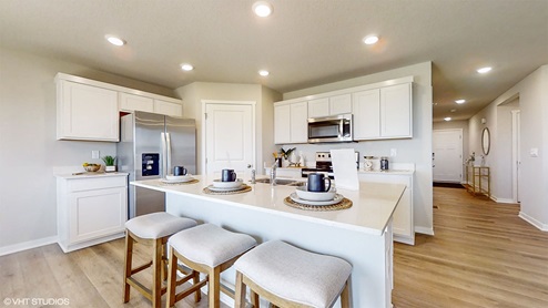 Hamilton kitchen with white cabinets and large island with 3 chairs