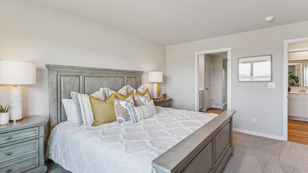 Primary bedroom of the Reagan with king bed