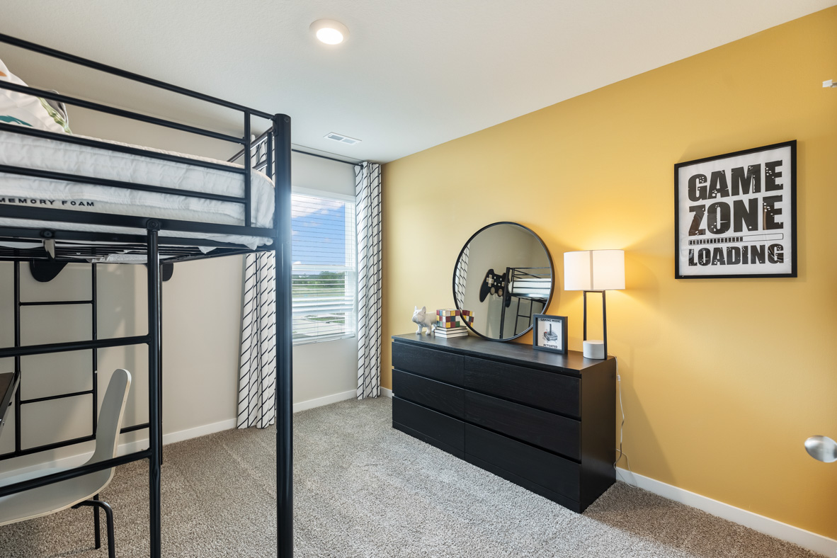 Fourth bedroom with yellow accent wall