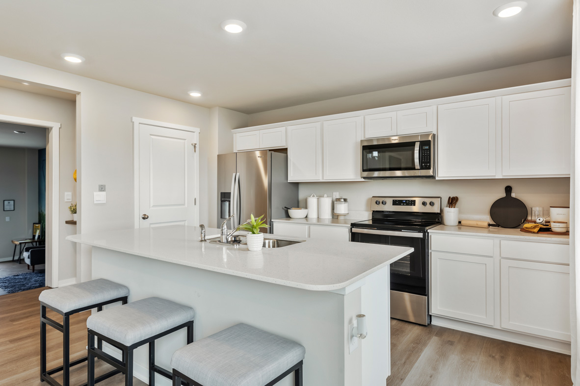 Kitchen with white cabinetry and stainless-steel appliances