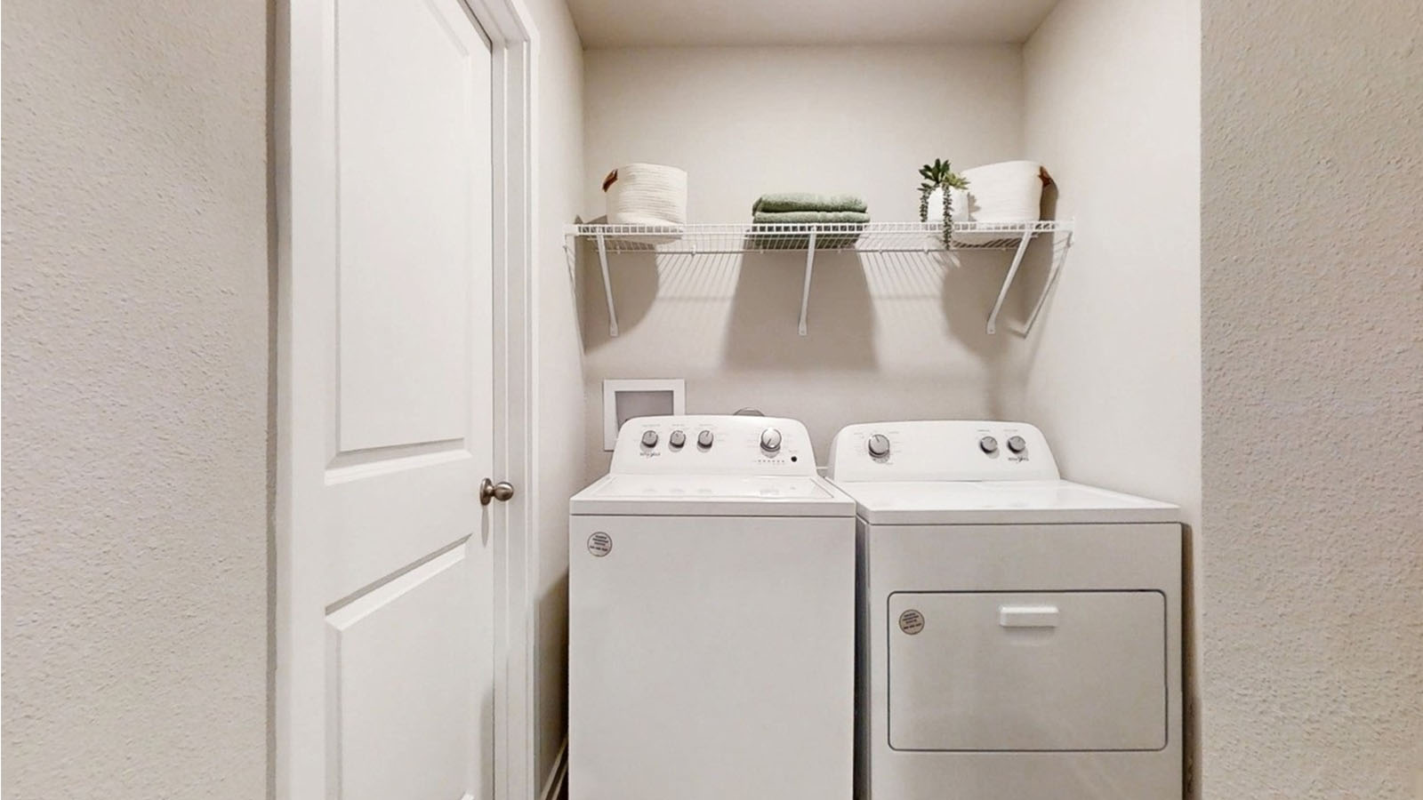 Laundry room with shelves in the Emerson