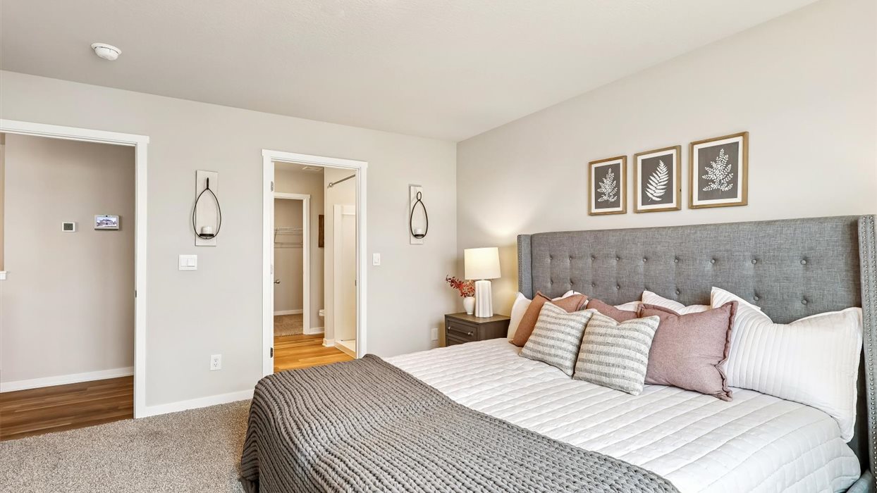 Master bedroom of harmony with king size bed and ensuite bsathroom