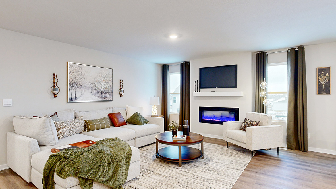 Reagan living room with sectional and white chair